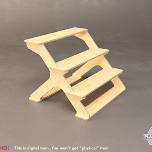 May include: A three-tiered wooden display stand with a natural finish. The stand has a stepped design, with each level slightly smaller than the one below. The base features an X-shaped support structure. The text "WARNING! This is digital item. You won't get "physical" item" is visible.