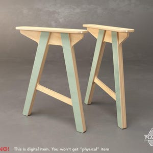 May include: Two wooden sawhorse style sawhorses with light green accents. The sawhorses have a natural wood finish on the top and the legs are painted light green. The sawhorses are digital items. The text "WARNING! This is digital item. You won't get "physical" item" is visible.