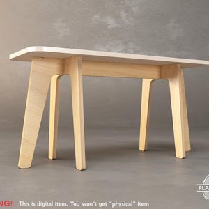 May include: A white tabletop with a light wood base. The table has a simple, modern design with four legs.