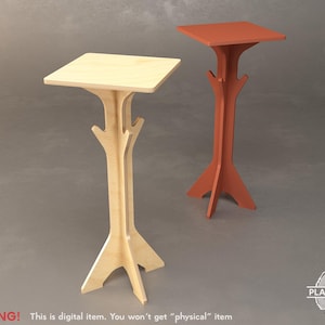 Puede incluir: Dos soportes decorativos de madera con tapas cuadradas y soportes en forma de árbol. Un soporte es de madera natural, el otro está pintado de naranja. Son artículos digitales, como indica el texto de advertencia en la imagen.