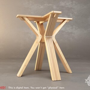 May include: A light-colored wooden table with a unique, geometric design. The table has a star-shaped top supported by angled legs. The legs are constructed from multiple vertical wooden slats. The text "WARNING! This is digital item. You won't get "physical" item" is visible.