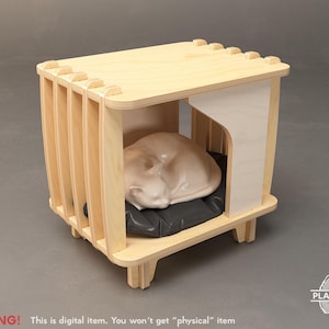 Könnte beinhalten: Ein helles Katzenhaus aus Holz mit einer schlafenden Katzenfigur im Inneren. Das Haus hat eine rechteckige Form mit vertikalen Lamellen an den Seiten und einem flachen Dach. Ein schwarzes Kissen bietet dem Kätzchen ein bequemes Bett. Der Text "WARNING! This is digital item. You won't get "physical" item" steht unten.