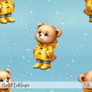 Könnte beinhalten: Ein sich wiederholendes Muster mit Cartoon-Teddybären in gelben Regenmänteln und Stiefeln vor einem hellblauen Hintergrund mit Wassertropfen. Die Bären haben rosige Wangen und lächeln. Der Text "Nicht Exklusiv" ist unten sichtbar.