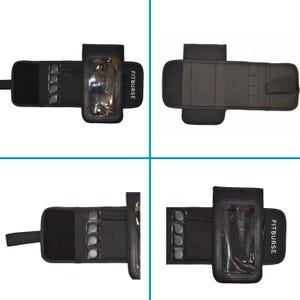 May include: Black armband with a clear phone holder and the text "FITBURSE". The armband has a mesh pocket and several small, round, gray objects. The design includes a hook and loop fastener for secure wear.