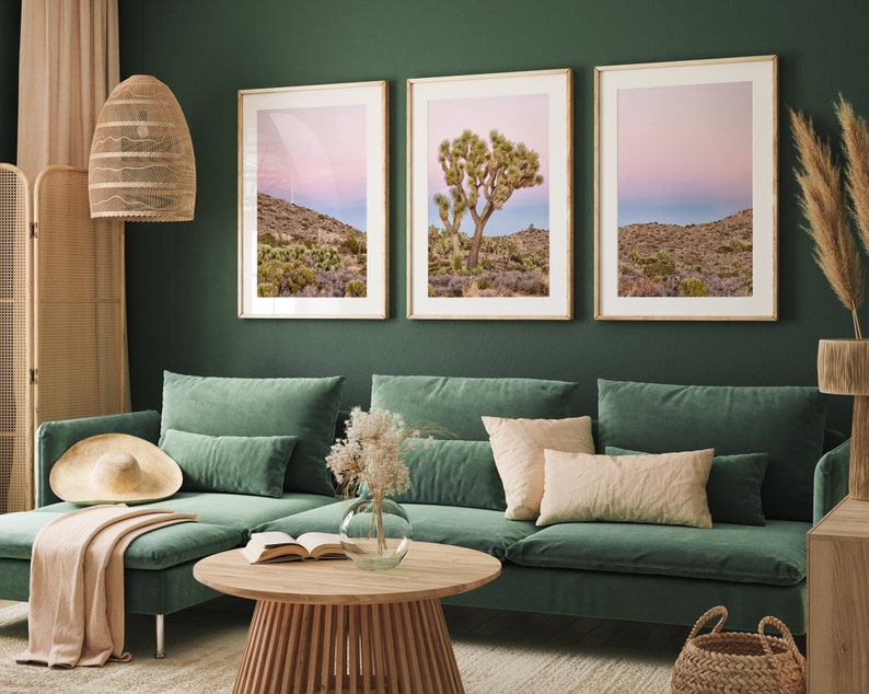 A wall art set of 3 framed or unframed Joshua Tree National Park prints.  This desert wall art showcases a stunning Joshua Tree and the desert terrain and plants in a breathtaking Pink sunset filled with Pink and Purple hues. Modern gallery wall set