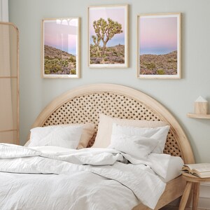 A wall art set of 3 framed or unframed Joshua Tree National Park prints.  This desert wall art showcases a stunning Joshua Tree and the desert terrain and plants in a breathtaking Pink sunset filled with Pink and Purple hues. Modern gallery wall set