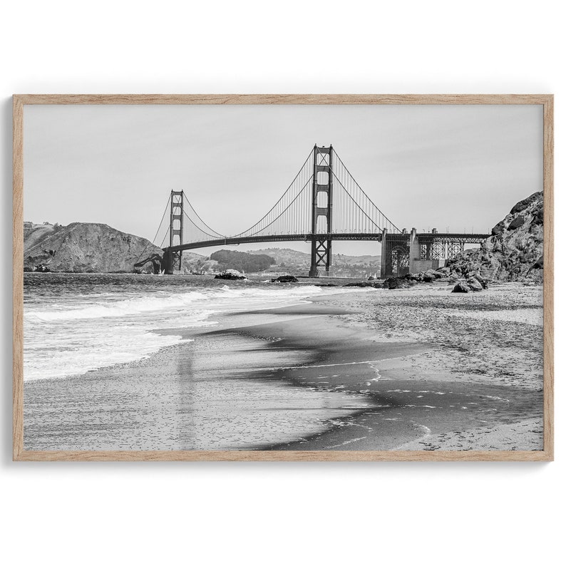 Fine art black and white print of Golden Gate Bridge from Baker Beach, San Francisco. Bridge with reflection in beach surf. Framed or unframed option available