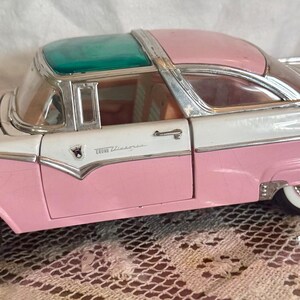 1:18 Scale Diecast Model of a Pink and White 1955 Ford Fairlane