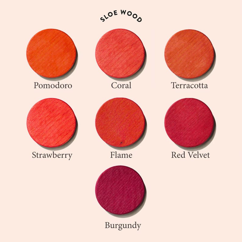 May include: A chart of seven different shades of red wood stain, labeled "Pomodoro", "Coral", "Terracotta", "Strawberry", "Flame", "Red Velvet", and "Burgundy". The chart is titled "Sloe Wood".