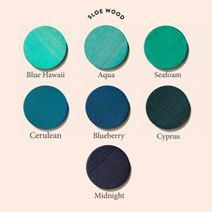 May include: Sloe Wood paint color chart with 7 different shades of blue, including Blue Hawaii, Aqua, Seafoam, Cerulean, Blueberry, Cyprus, and Midnight.