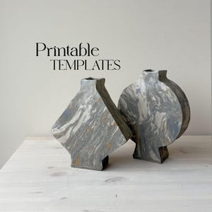 May include: Two ceramic vases with a marbled gray and white design. The vases are abstract in shape, one is round and the other is a diamond shape. The vases are sitting on a light wood surface. Printable TEMPLATES text is at the top of the image.