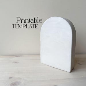 May include: Printable template for a white ceramic arch shape. The arch is smooth and has a rounded top.