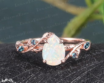 Vintage pear shaped white opal engagement ring Unique 14k rose gold nature inspired promise ring Art deco leaf design ring Anniversary gifts