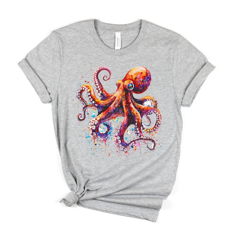 Puede incluir: Camiseta gris con una ilustraci&oacute;n de acuarela de un pulpo con tent&aacute;culos rojos, morados y azules.
