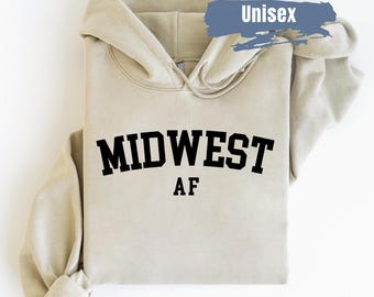 May include: A beige unisex hoodie with the text "MIDWEST AF" printed in black.
