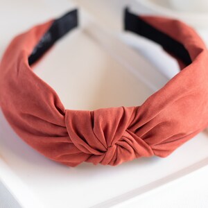 A close-up of one range headband featuring a top knot detail.