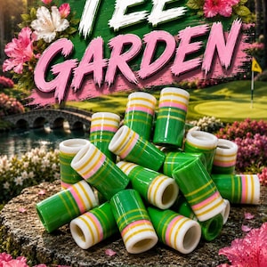 May include: A collection of cylindrical golf tee bands featuring a green base with horizontal stripes in white, yellow, and pink. The text TEE GARDEN is displayed at the top, and the text BIRDIE BANDS.CA is at the bottom with a bird icon.