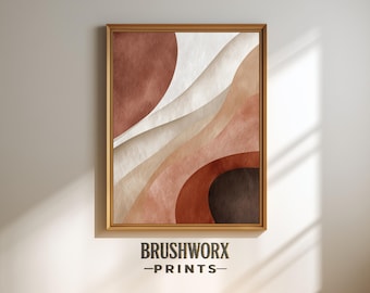 May include: Framed abstract art print featuring layered shapes in shades of brown, beige, and white. The artwork has a textured appearance and is enclosed in a gold-colored frame. The text "BRUSHWORX -PRINTS-" is at the bottom.
