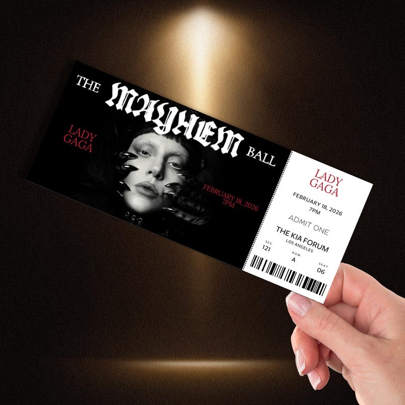 May include: A black and white ticket for "The Mayhem Ball" featuring Lady Gaga, with the date February 18, 2026, and the venue, The Kia Forum in Los Angeles. The ticket is being held by a hand.