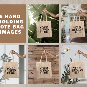 May include: Five images of hands holding a beige tote bag. The bag has black text that says "Your Design Here". The images show the bag in different settings, including a wooden wall, a green leafy background, and a white wall with a shadow.