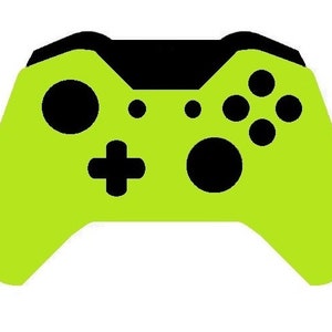 以下が含まれることがあります： 黒色のボタンと黒色のトップを持つライムグリーンのビデオゲームコントローラーです。