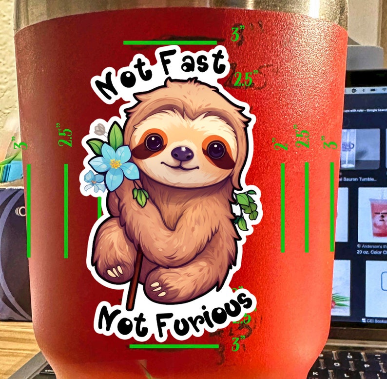 May include: A red stainless steel tumbler with a sloth graphic and the text "Not Fast Not Furious".