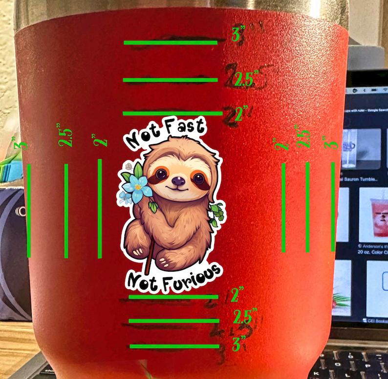 May include: Red stainless steel tumbler with a sloth graphic and the text "Not Fast Not Furious". The tumbler has measurements marked in inches.