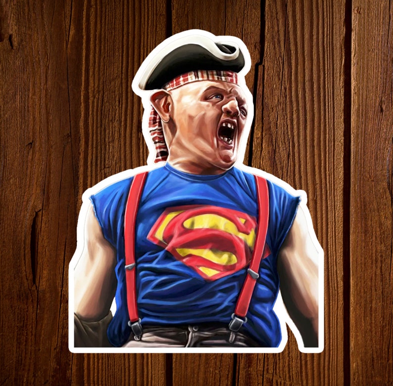 K&ouml;nnte beinhalten: Ein Aufkleber mit einer Comicfigur, die ein rot-wei&szlig; gestreiftes Bandana, ein blaues Shirt mit Superman-Logo und rote Hosentr&auml;ger tr&auml;gt. Die Figur hat einen &uuml;berraschten Gesichtsausdruck und tr&auml;gt einen schwarz-wei&szlig;en Piratenhut.