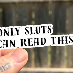 May include: White sticker with black text that reads "ONLY SLUTS CAN READ THIS."