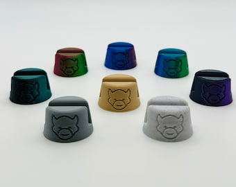 May include: Set of ten colorful 3D printed caps with a cartoon animal face design. The caps are in various colors, including teal, purple, gray, brown, and white.