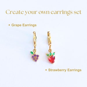 14K Gold-filled hoop earrings are designed with fruit charms that exude elegance and playfulness. purple and rose zircon on the grape and strawberry earrings. These sweet and cottagecore jewelry make for daughter present and plant mom gift.