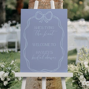 She's tying the knot signage, printable scribble bow bridal shower welcome poster, editable welcome board, canva template, ribbon blue - HD2