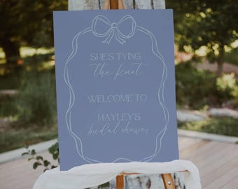 She's tying the knot signage, printable scribble bow bridal shower welcome poster, editable welcome board, canva template, ribbon blue - HD2