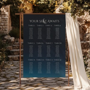 May include: A dark blue wedding seating chart with a crescent moon and stars design. The chart is titled "Your Seat Awaits" and lists tables 1 through 12 with guest names.