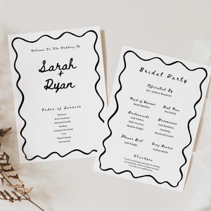 May include: Two white wedding programs with black wavy borders and text. One reads "Sarah + Ryan" and "Order of Service." The other lists the "Bridal Party." A fern and ribbon are in the background.