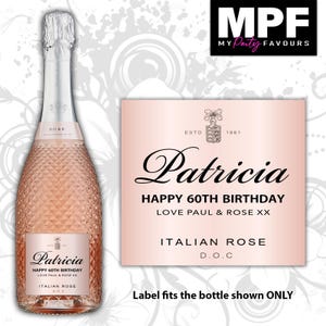 May include: A bottle of rose sparkling wine with a textured glass surface and a custom pink label that reads Patricia, HAPPY 60TH BIRTHDAY, LOVE PAUL & ROSE XX, ITALIAN ROSE D.O.C. The bottle features a silver foil neck wrap and a clear glass base.