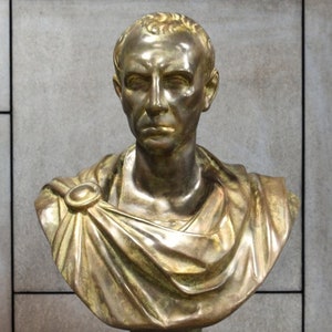 Bust of Julius Caesar. Molded marble, bronze patina. 25.2in. Handmade in Europe.