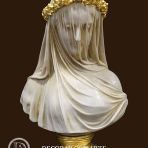 May include: White marble bust of a woman wearing a veil and a gold leaf crown of flowers. The bust is on a gold pedestal.