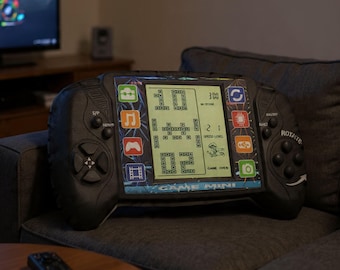 Kudde till spelkontroll, kudde till videospel, inredning till spelrum, konsoluppsättning, present till spel