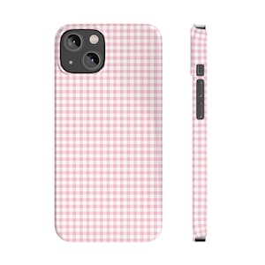 May include: A pink and white gingham phone case for an iPhone.