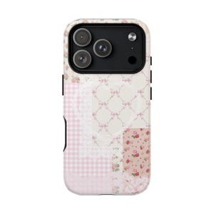 May include: A smartphone case featuring a patchwork design of light pink and white patterns, including gingham checks, small pink bows on a cream background, and floral prints with red roses, finished with white lace-like decorative accents.