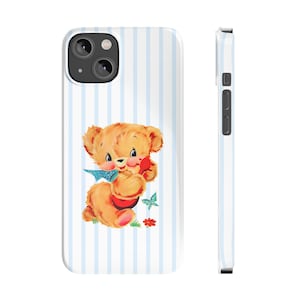 May include: A white phone case with blue stripes and a vintage illustration of a teddy bear holding a red phone. The teddy bear is wearing a blue bow tie and is surrounded by flowers.