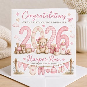 May include: A square greeting card featuring the text Congratulations ON THE BIRTH OF YOUR DAUGHTER, 2026, Harper Rose, 28th August 2026, and 5lb 9oz. The design includes a teddy bear, toy train, baby bottle, and clothes hanging on a line.