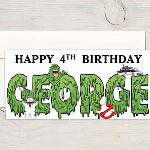 May include: A green and white birthday card with the text "Happy 4th Birthday George" in black letters. The letters are made of green slime with characters from the film Ghostbusters.