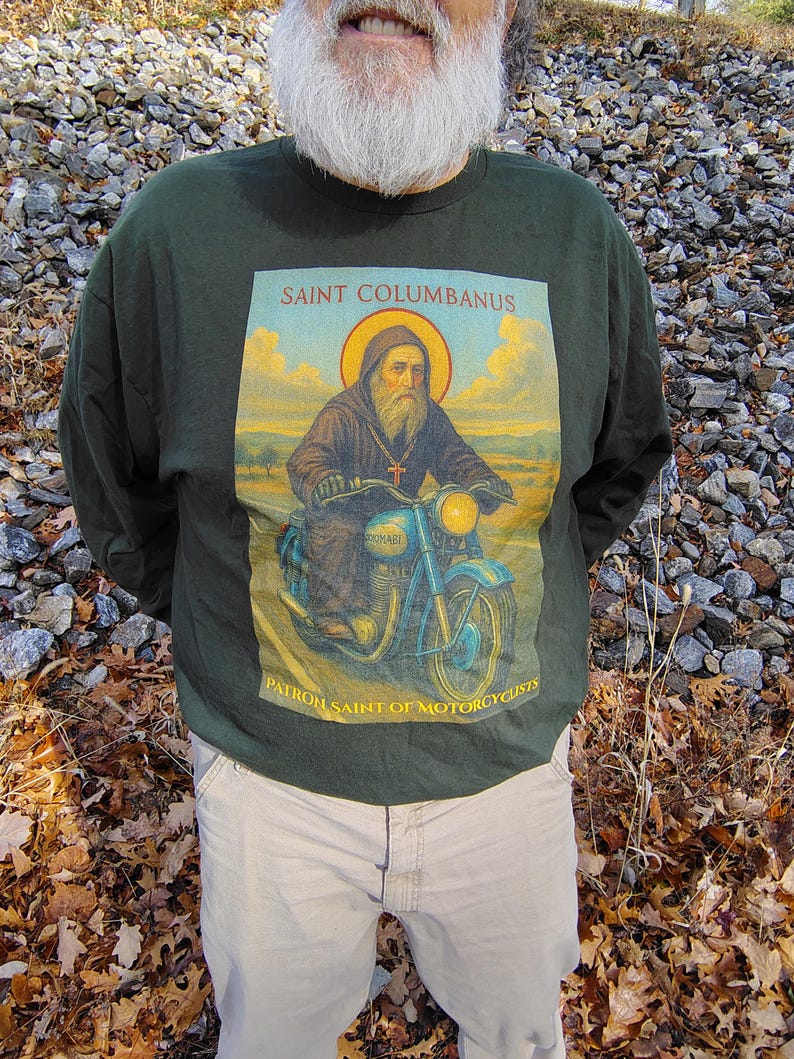 Cotton Long Sleeve Tee Motorcyclist Saint Design Comfortable Wear Premium Material Taped Shoulders No Side Seams Durable Construction Religious Biker Apparel Catholic Faith Expression Unisex Fit Classic Style Perfect Gift Idea Motorcycle