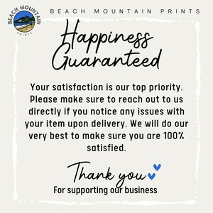 May include: A cream-colored print with the text "Happiness Guaranteed" in a handwritten font. The print also includes the text "Your satisfaction is our top priority" and "Thank you for supporting our business."