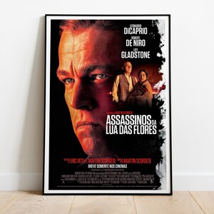 May include: Movie poster for the film "The  Assassins of the Moon Flowers" starring Leonardo DiCaprio, Robert De Niro, and  Lily Gladstone. The poster features a close-up of Leonardo DiCaprio's face with a red and black background.