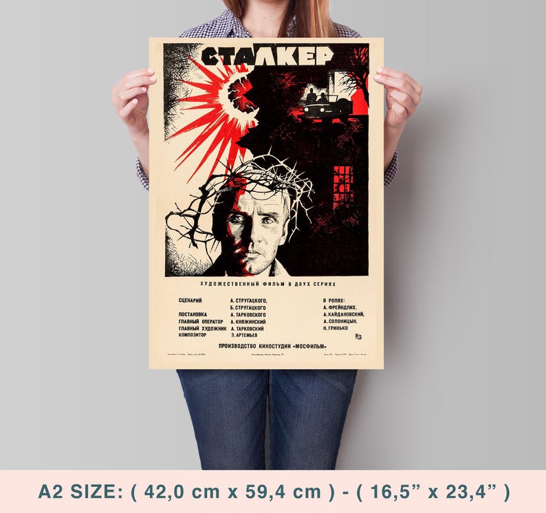May include: A vintage movie poster for the film "Stalker" in red, black, and white. The poster features a man with a crown of thorns and the title of the film in Cyrillic script. The poster also includes the film's credits in Russian.