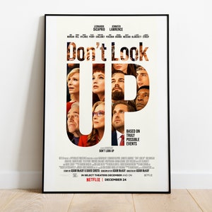 May include: Film poster for the movie "Don't Look Up" starring Leonardo DiCaprio and Jennifer Lawrence. The poster is black and white with a red "U" in the title. The actors' faces are visible through the letters of the title.