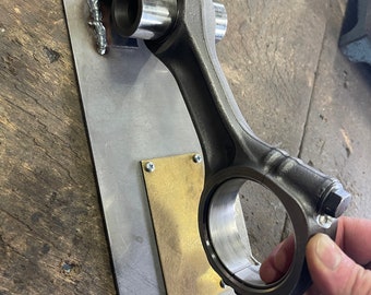 Handcrafted door knocker a connecting rod of a diesel engine